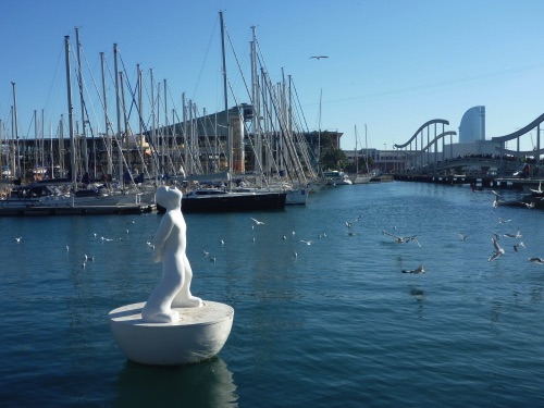 View of or mooring, Rambla pedestrian bridge, and Maremagnum Centre from the city quay.